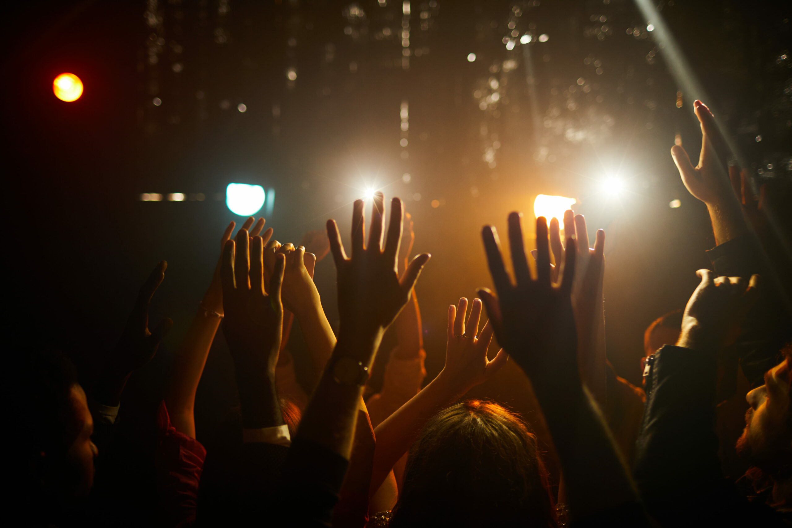 people-waving-hands-at-concert-2023-11-27-05-26-17-utc